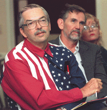 Madison, Wis - Dave Johnston listens as the candidates for governor promise to deliver their property tax plans.